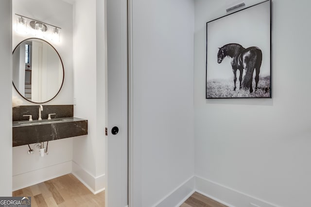 bathroom featuring hardwood / wood-style floors and sink