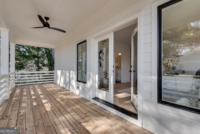 wooden deck with ceiling fan