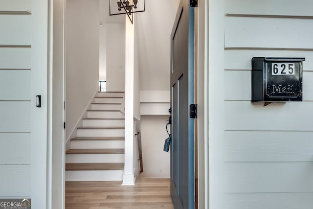 staircase featuring hardwood / wood-style flooring