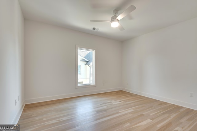 unfurnished room with light hardwood / wood-style flooring and ceiling fan