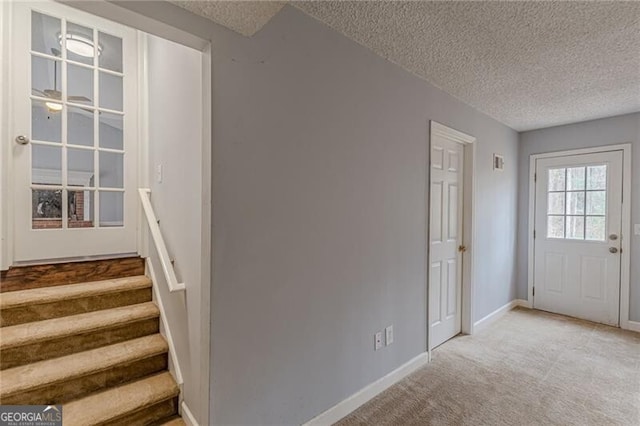 interior space featuring a textured ceiling