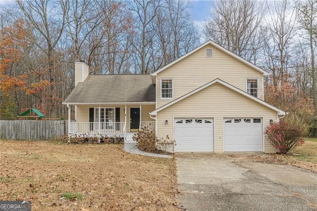 view of front of property featuring a porch and a garage