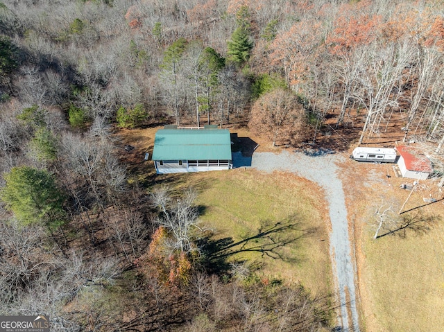 aerial view featuring a view of trees