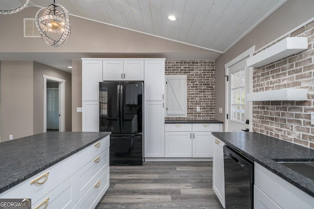 kitchen featuring black appliances, hardwood / wood-style floors, white cabinetry, hanging light fixtures, and lofted ceiling