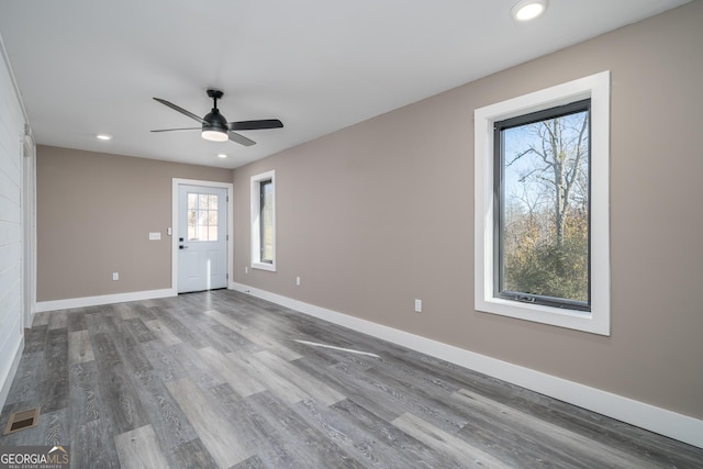 unfurnished living room featuring visible vents, baseboards, wood finished floors, recessed lighting, and a ceiling fan
