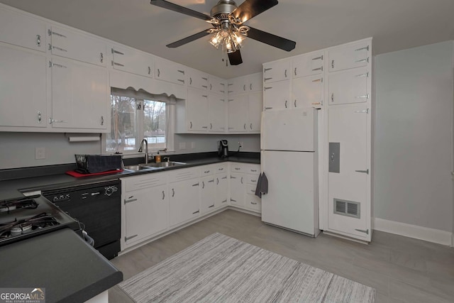 kitchen featuring ceiling fan, sink, black dishwasher, white refrigerator, and white cabinets