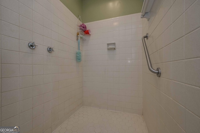 bathroom with tiled shower