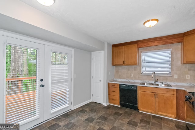 kitchen with backsplash, sink, a textured ceiling, and black dishwasher