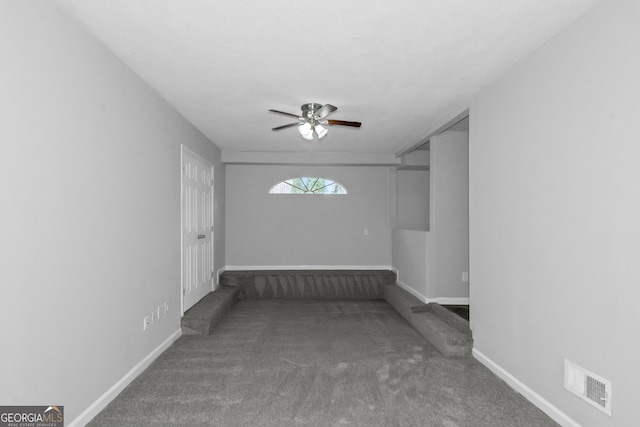 spare room with carpet and ceiling fan