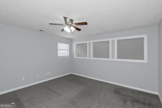 carpeted empty room with ceiling fan