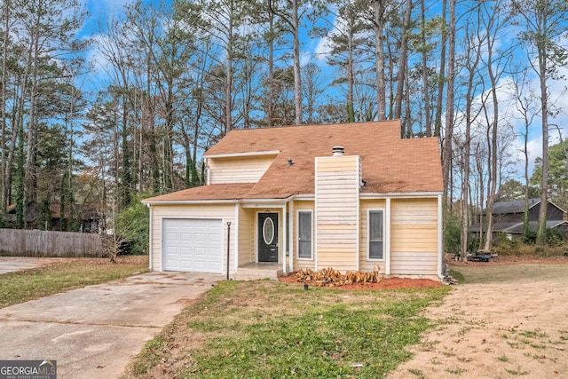 front of property with a front lawn and a garage