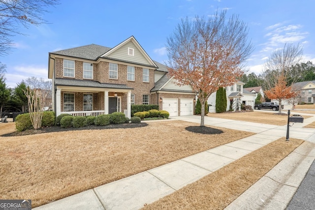 view of front of home with covered porch and a garage