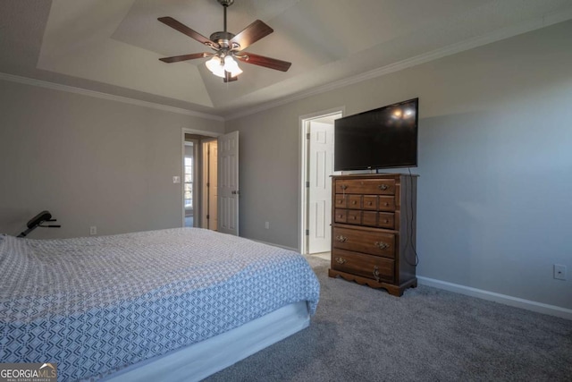 bedroom with carpet, a raised ceiling, ceiling fan, and crown molding