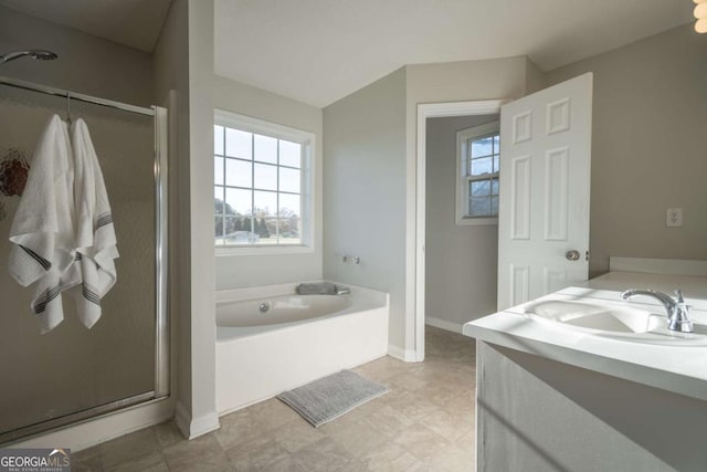 bathroom featuring plus walk in shower and vanity