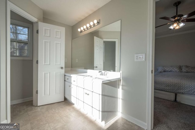 bathroom featuring ceiling fan, crown molding, and vanity