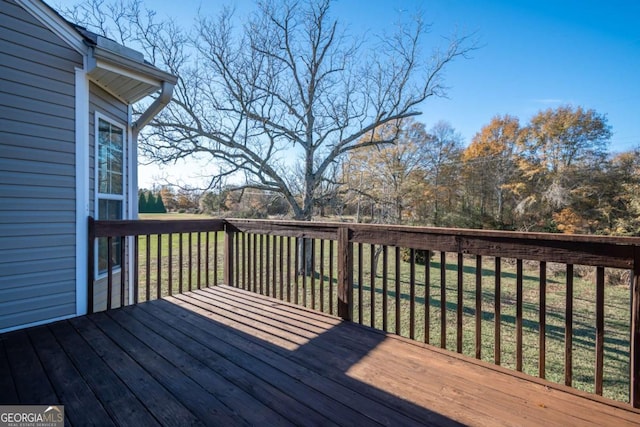 wooden deck with a yard