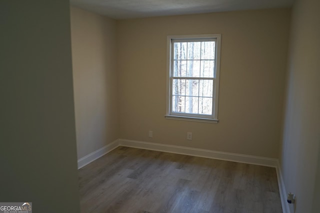 unfurnished room featuring light hardwood / wood-style floors