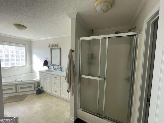 bathroom with ornamental molding, shower with separate bathtub, and vanity