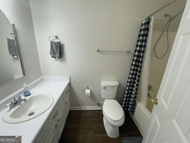 full bathroom featuring vanity, toilet, and shower / tub combo with curtain