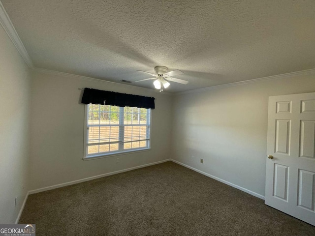 spare room with dark colored carpet, ceiling fan, ornamental molding, and a textured ceiling