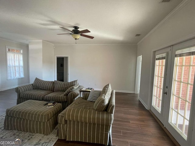 living room with french doors, dark hardwood / wood-style floors, ceiling fan, and ornamental molding