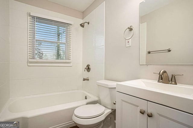 full bathroom featuring vanity, toilet, and tiled shower / bath