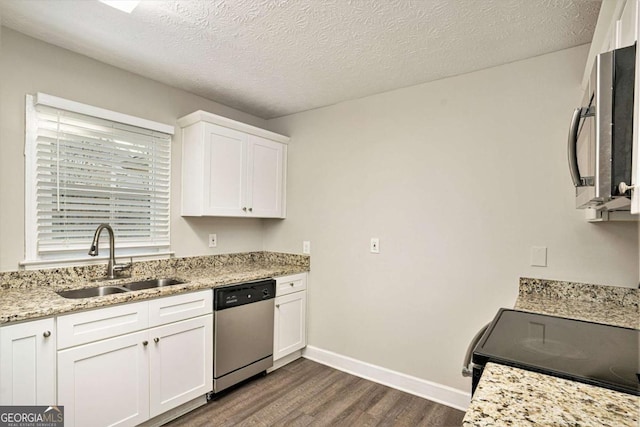 kitchen featuring dark wood-type flooring, sink, white cabinets, and stainless steel appliances