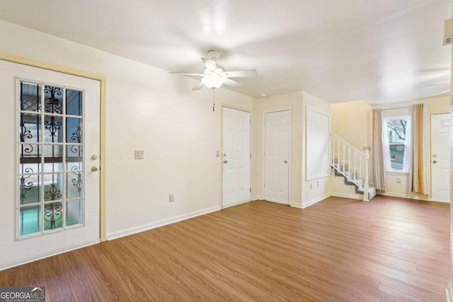 foyer featuring hardwood / wood-style flooring and ceiling fan