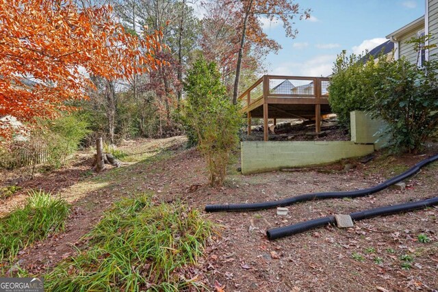 view of yard featuring a deck