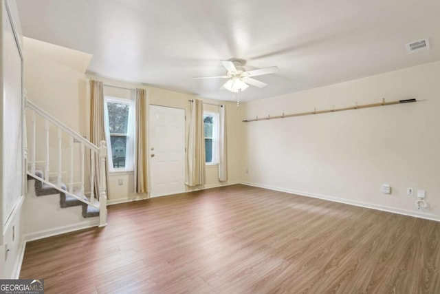 entrance foyer with hardwood / wood-style flooring and ceiling fan