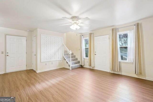 interior space featuring light hardwood / wood-style floors and ceiling fan