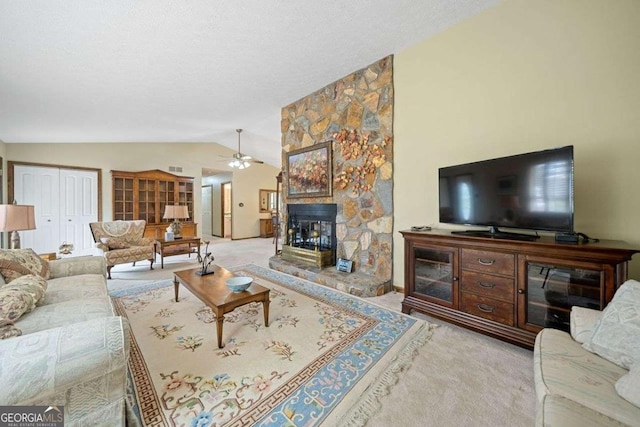 living room featuring light carpet, a fireplace, ceiling fan, and lofted ceiling