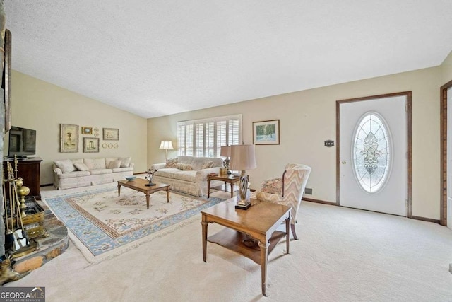 carpeted living room featuring lofted ceiling and a textured ceiling