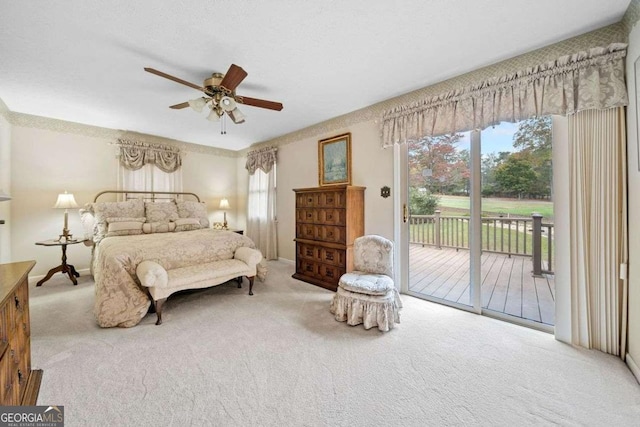 bedroom with ceiling fan, light carpet, and access to outside