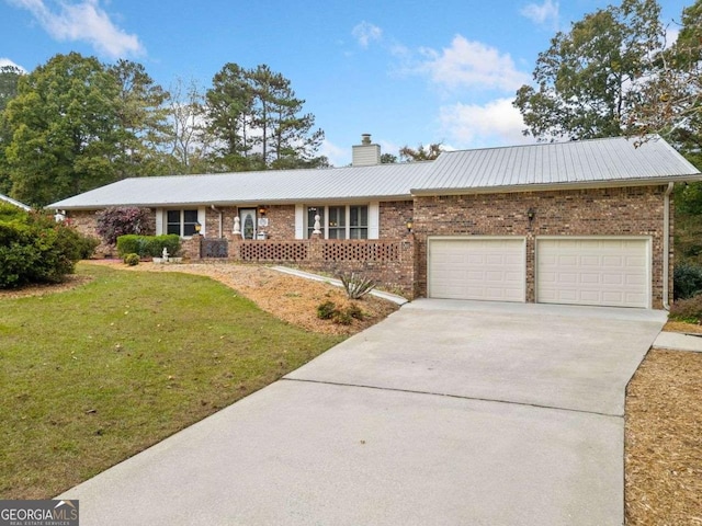 ranch-style home with a garage and a front yard