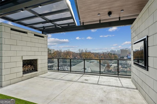 view of patio / terrace featuring exterior fireplace