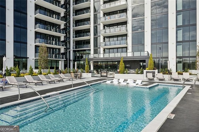 view of swimming pool featuring a patio