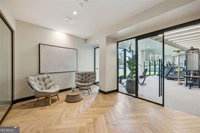 sitting room featuring light parquet floors