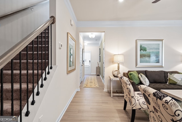 hallway with ornamental molding and light wood-type flooring