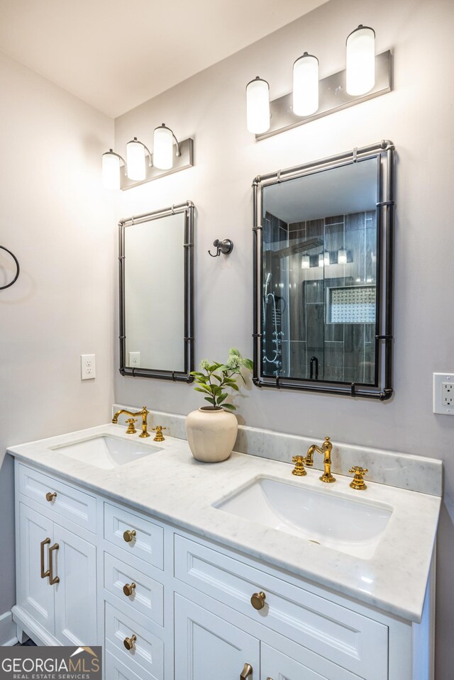 kitchen with sink, white cabinets, hanging light fixtures, and a notable chandelier