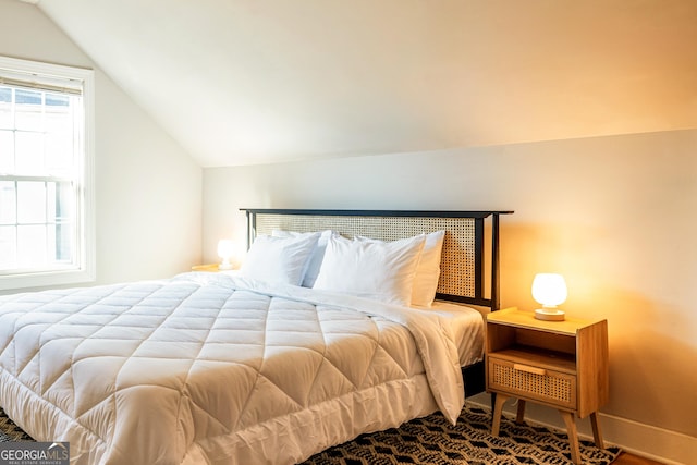 bedroom with vaulted ceiling