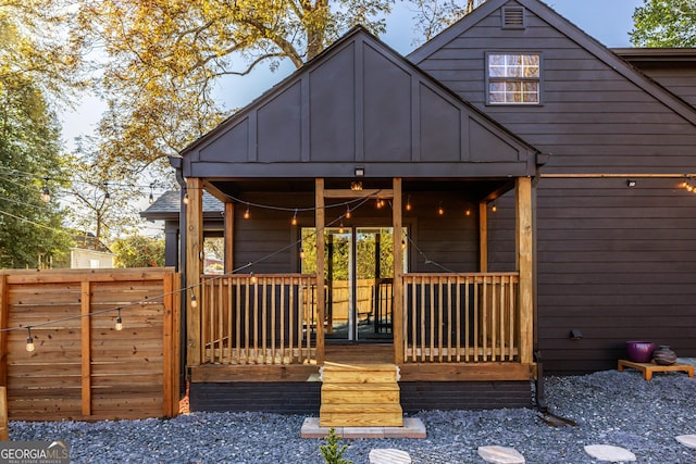 back of house featuring a porch