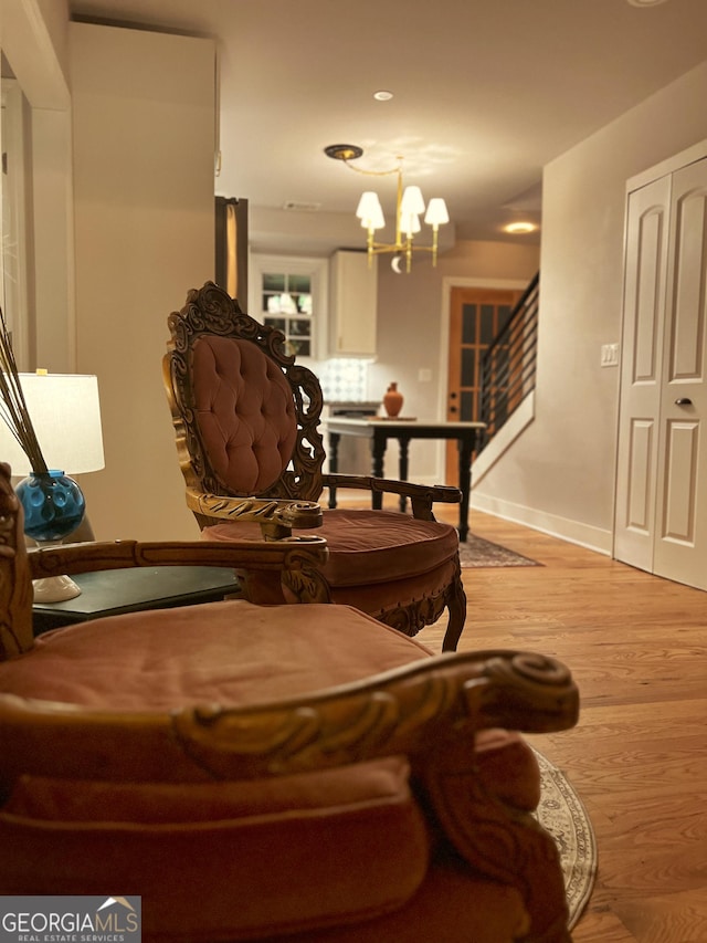 interior space featuring a notable chandelier and light wood-type flooring