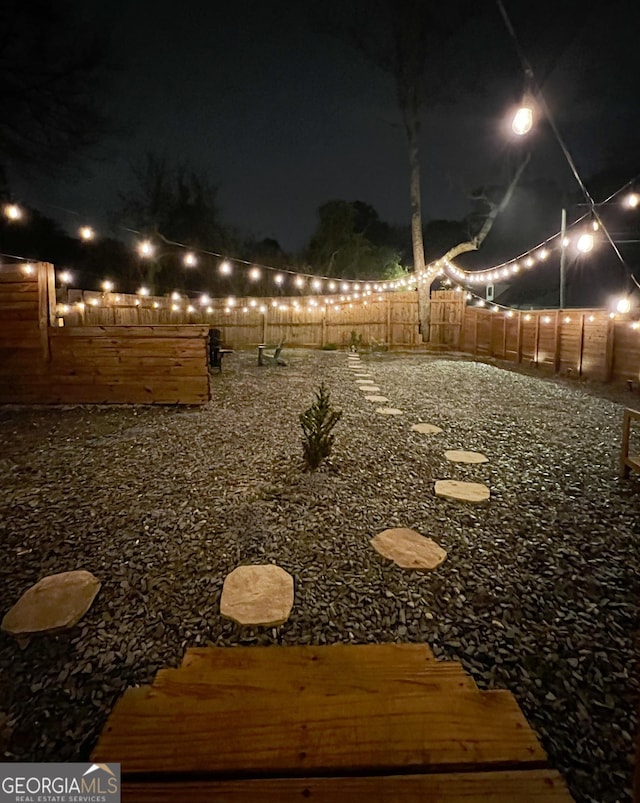 view of yard at night