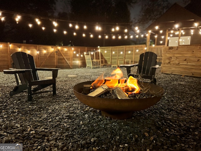 patio at twilight with an outdoor fire pit