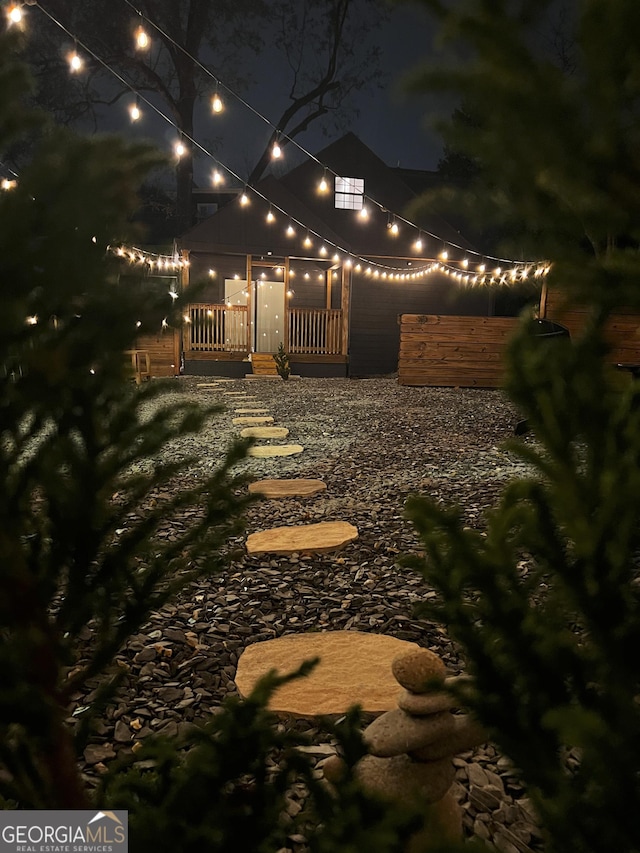 view of yard at twilight