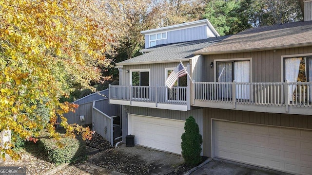 view of front of house with a balcony and central AC