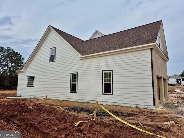 view of side of property with a garage