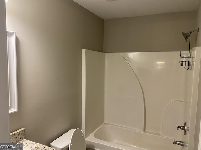 full bathroom with  shower combination and toilet