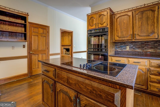 unfurnished room with crown molding, dark hardwood / wood-style flooring, a chandelier, and french doors